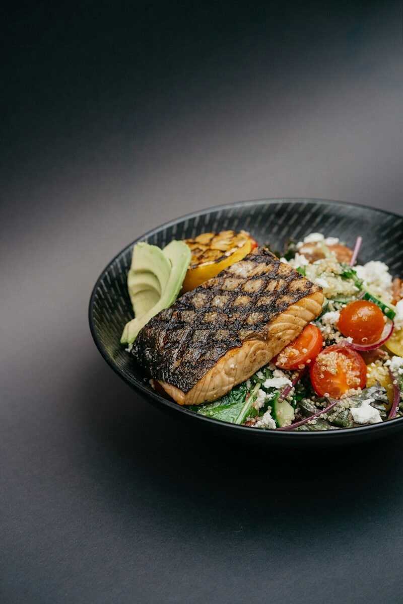 Grilled salmon with avocado and vegetables