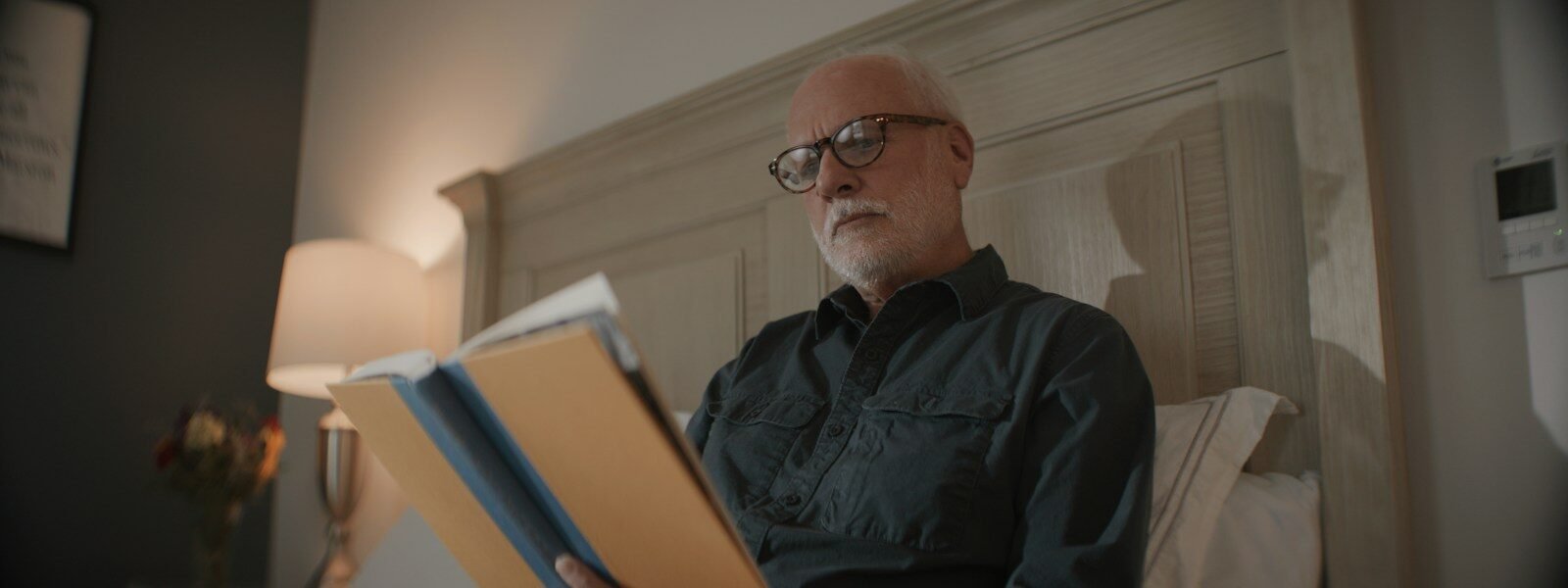 Senior man reading with glasses