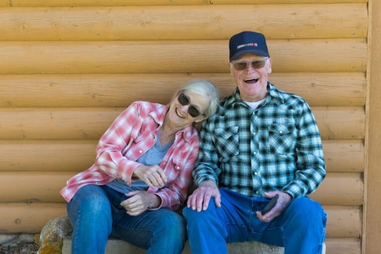 Older couple sitting together outdoors